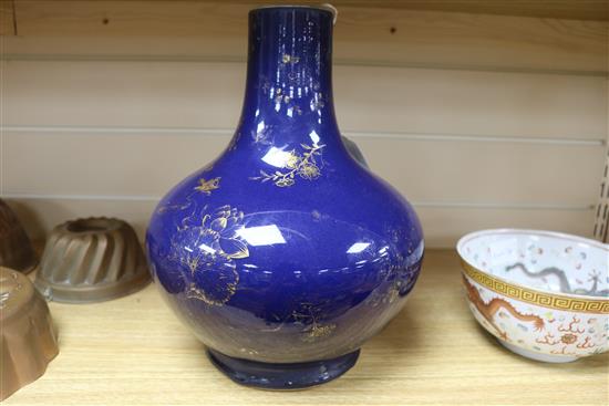 A Chinese Kangxi style dark powder blue ground vase, with gilt decoration of flowers and fruit,